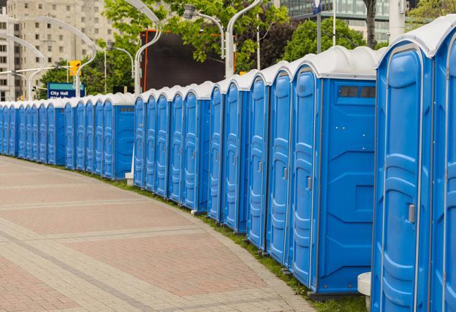 a line of portable restrooms set up for a wedding or special event, ensuring guests have access to comfortable and clean facilities throughout the duration of the celebration in Fort Myers Beach FL